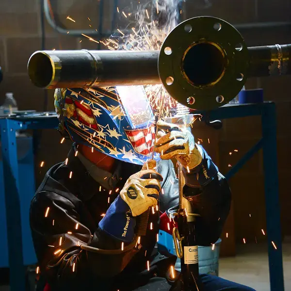 Pipefitter grinding a pipe